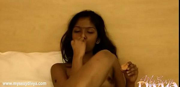  Divya naked in bed rubbing her shaved pussy - Indian Porn